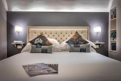 Letto o letti in una camera di Palazzo Ridolfi - Residenza d'Epoca