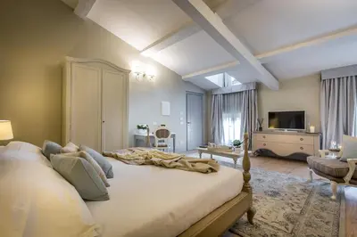 Letto o letti in una camera di Palazzo Ridolfi - Residenza d'Epoca