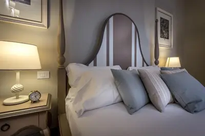 Letto o letti in una camera di Palazzo Ridolfi - Residenza d'Epoca