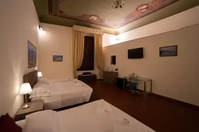 Letto o letti in una camera di Coco Places Soggiorno Panerai, Centro Storico