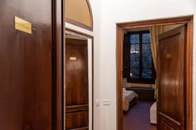 Letto o letti in una camera di Coco Places Soggiorno Panerai, Centro Storico