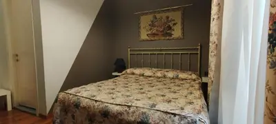 Letto o letti in una camera di Soggiorno Michelangelo