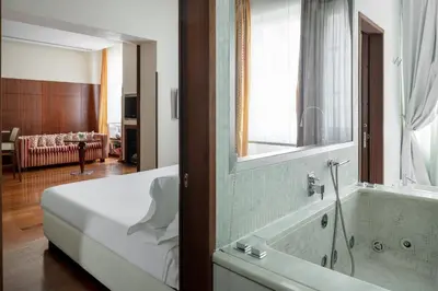 Letto o letti in una camera di Ricasoli Firenze Luxury Apartments | UNA Esperienze