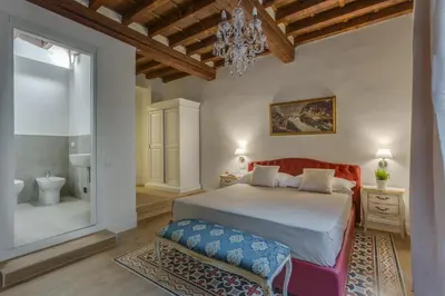 Letto o letti in una camera di Residenze d'epoca Collection-Sant'Anna