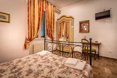 Letto o letti in una camera di Soggiorno Sogna Firenze