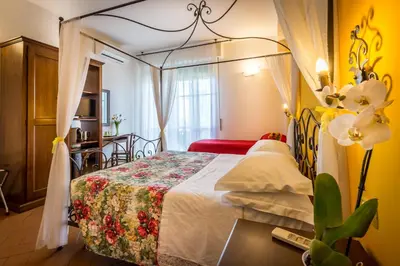 Letto o letti in una camera di B&B Antiche Armonie