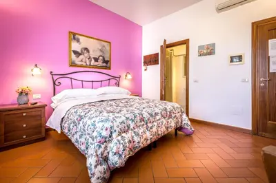 Letto o letti in una camera di B&B Antiche Armonie