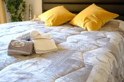 Letto o letti in una camera di Rodolfo Suite