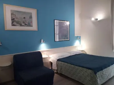 Letto o letti in una camera di Residenza Le Rondini