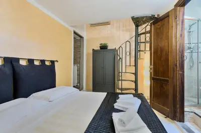 Letto o letti in una camera di Santo Spirito Frescos by Mmega