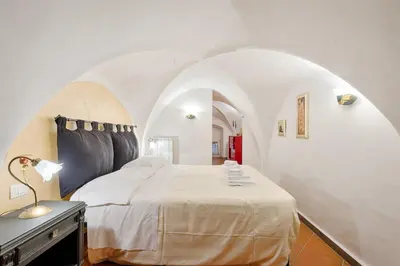 Letto o letti in una camera di Santo Spirito Frescos by Mmega