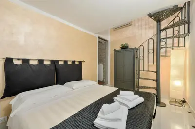 Letto o letti in una camera di Santo Spirito Frescos by Mmega