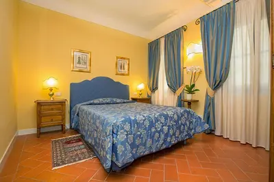 Letto o letti in una camera di La Casa Del Garbo - Luxury Rooms & Suite