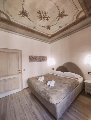 Letto o letti in una camera di Nashira Rooms B&B Affittacamere