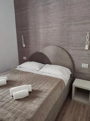 Letto o letti in una camera di Nashira Rooms B&B Affittacamere
