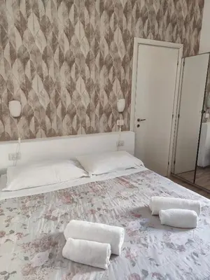 Letto o letti in una camera di Nashira Rooms B&B Affittacamere