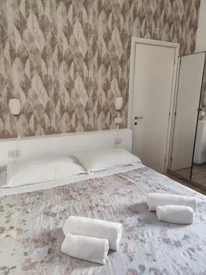 Letto o letti in una camera di Nashira Rooms B&B Affittacamere