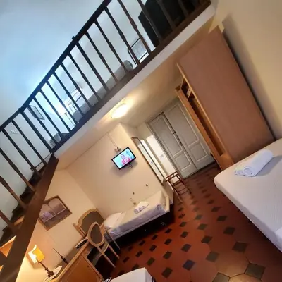 Letto o letti in una camera di Hotel Fedora