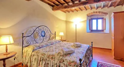 Letto o letti in una camera di Agriturismo I Ceppi