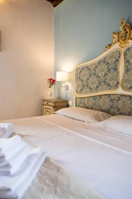 Letto o letti in una camera di Villa Il Fedino
