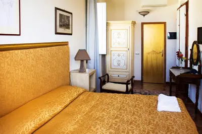 Letto o letti in una camera di Villa Il Fedino