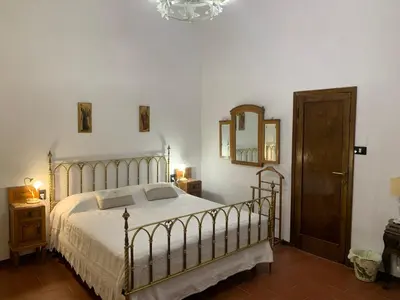 Letto o letti in una camera di B&B Le 5 Vie Appartamento con camera tripla