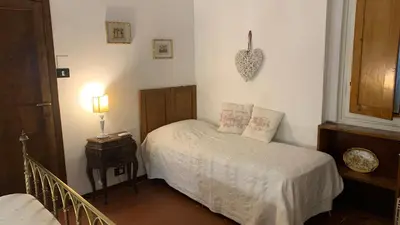Letto o letti in una camera di B&B Le 5 Vie Appartamento con camera tripla