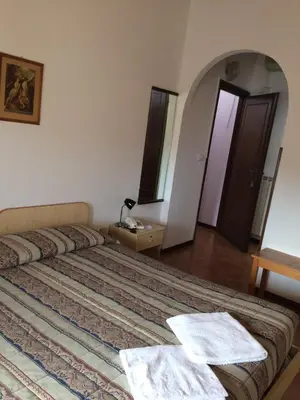 Letto o letti in una camera di Hotel Bodoni