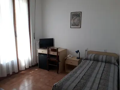 Letto o letti in una camera di Hotel Bodoni
