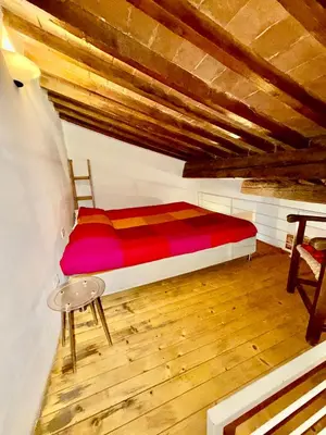 Letto o letti in una camera di Signoria Uffizi Suites