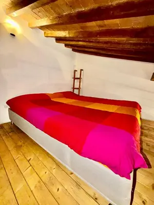 Letto o letti in una camera di Signoria Uffizi Suites
