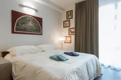 Letto o letti in una camera di Borgo Guelfo VII