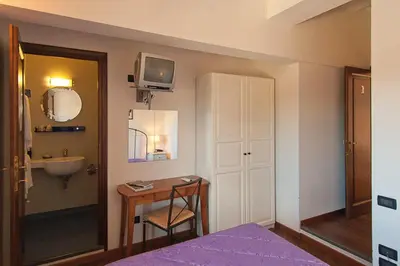Letto o letti in una camera di B&B Arco Antico