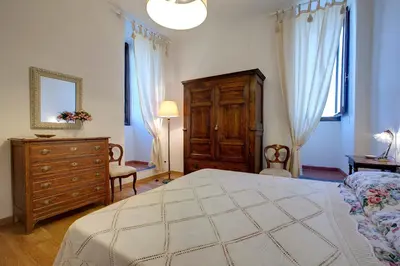Letto o letti in una camera di Torre Donati by Mmega