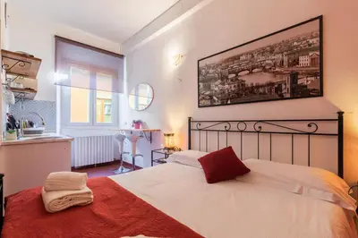 Letto o letti in una camera di Firenze Rentals Uffizi