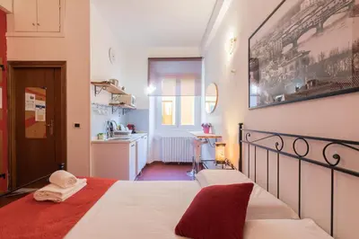Letto o letti in una camera di Firenze Rentals Uffizi