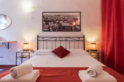 Letto o letti in una camera di Firenze Rentals Uffizi