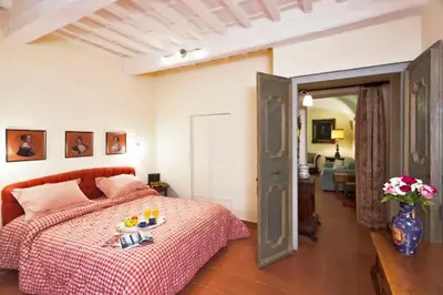 Letto o letti in una camera di Via dei Fossi apartment