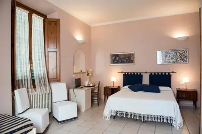 Letto o letti in una camera di Affittacamere Benedetta