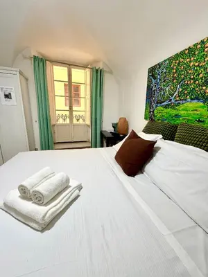 Letto o letti in una camera di Gattopardo Rooms Florence