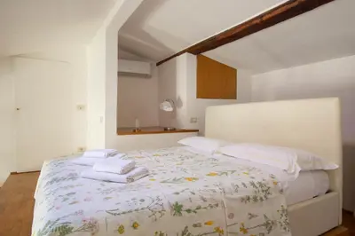 Letto o letti in una camera di Vasco Pratolini Apartment di Stefania Sesto