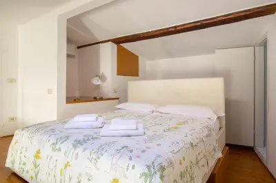 Letto o letti in una camera di Vasco Pratolini Apartment di Stefania Sesto