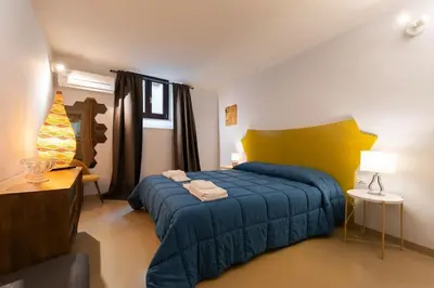 Letto o letti in una camera di Arch Apartment Duomo - Florence