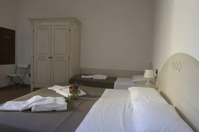 Letto o letti in una camera di La Spiga Affittacamere
