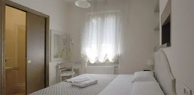 Letto o letti in una camera di La Spiga Affittacamere