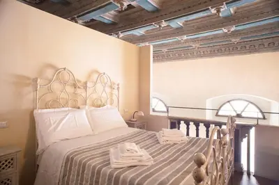 Letto o letti in una camera di Berardi Palace Apartments