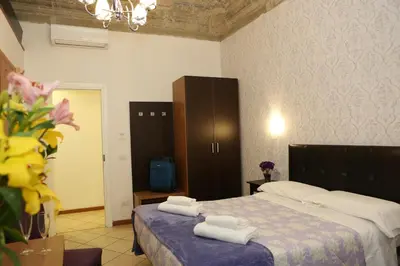 Letto o letti in una camera di Adelaide House