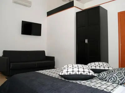 Letto o letti in una camera di Adelaide House