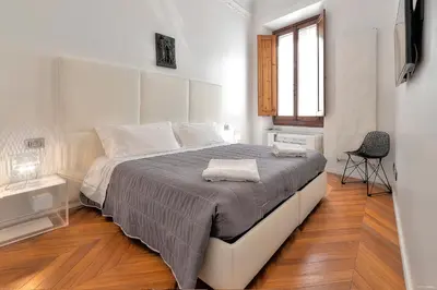 Letto o letti in una camera di Suite Deluxe Florence