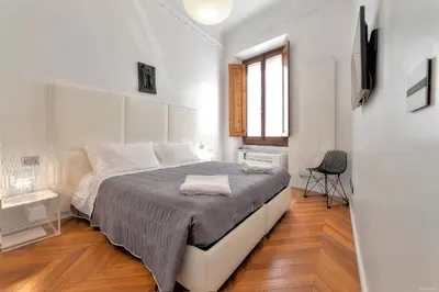 Letto o letti in una camera di Suite Deluxe Florence